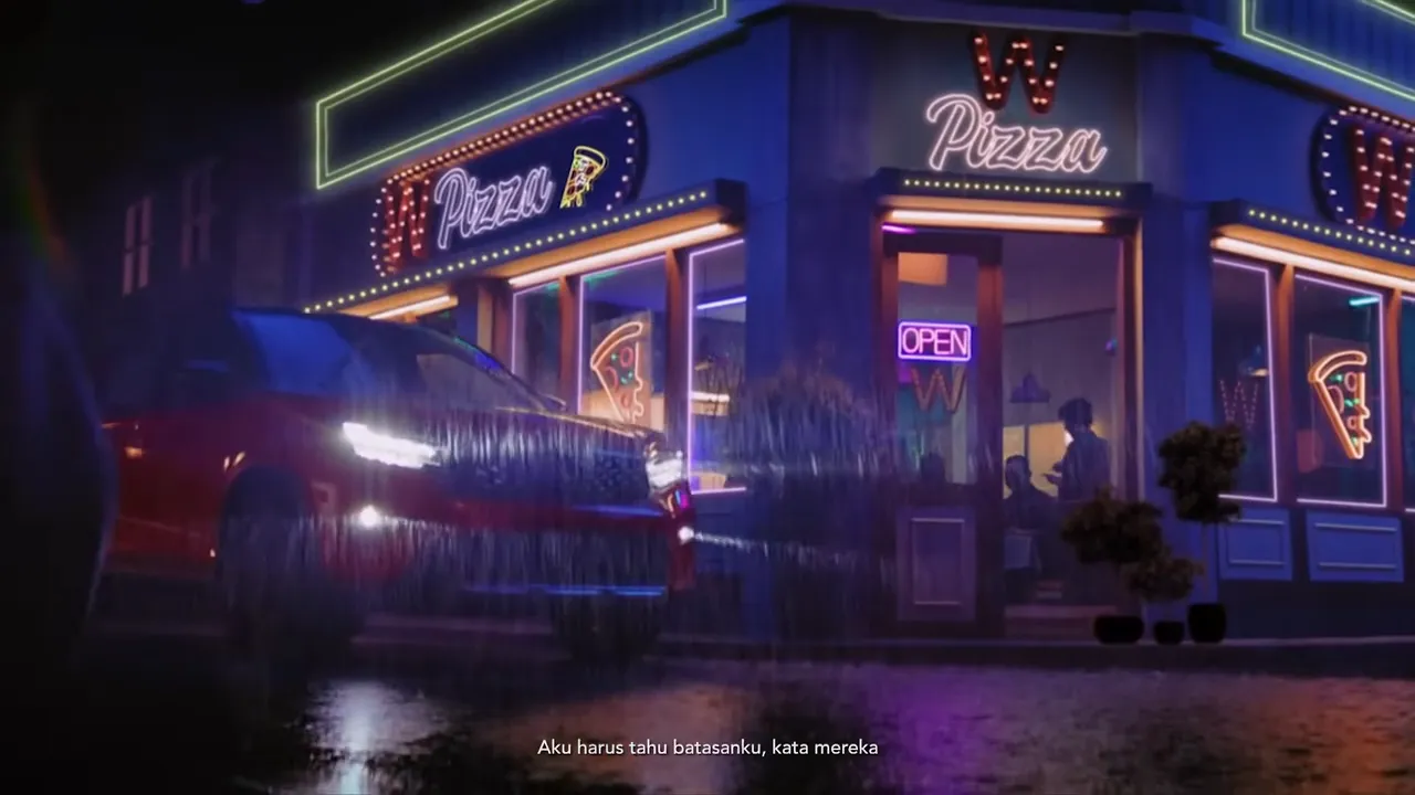 The red Honda WR-V passing a neon-lit pizzeria in the rain, from the launch film